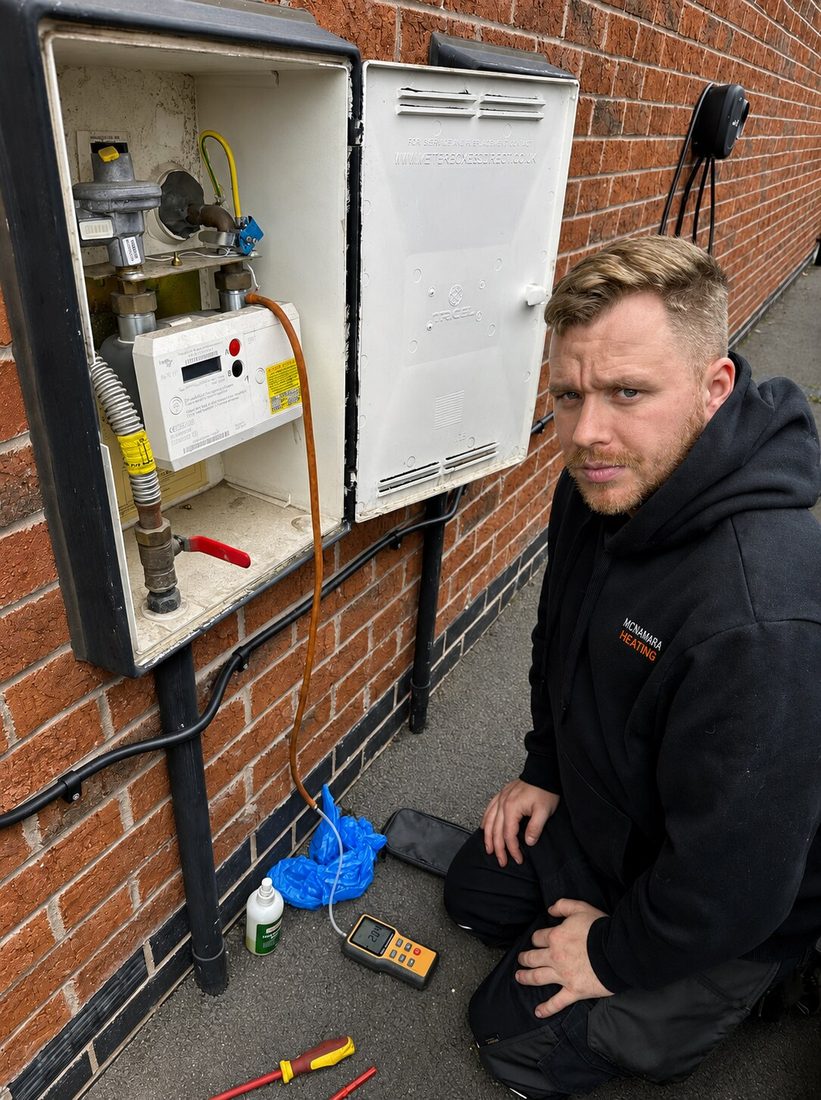 Stephen McNamara checking an external gas meter installation at a rental property in Greater Manchester